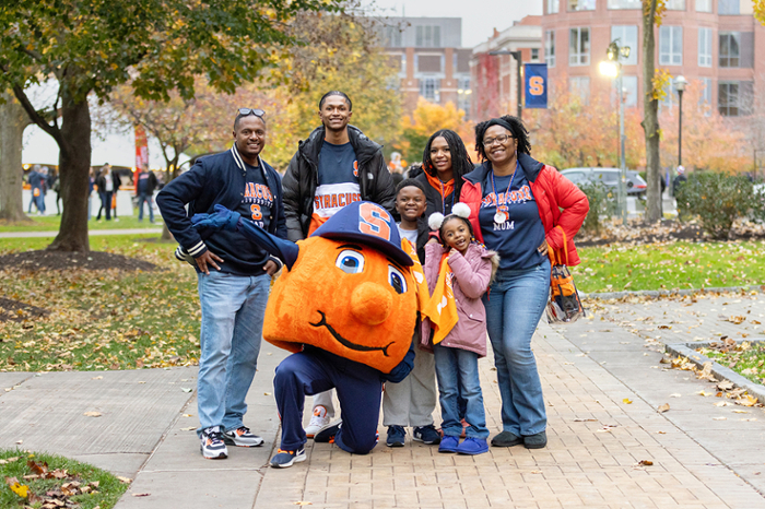 A family with Otto on campus